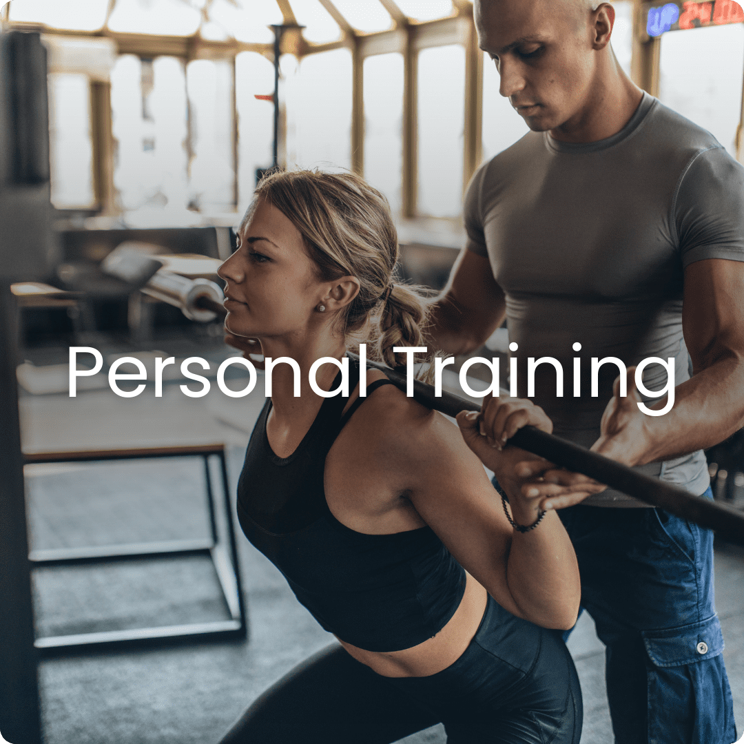 Woman receives personal training at gym.