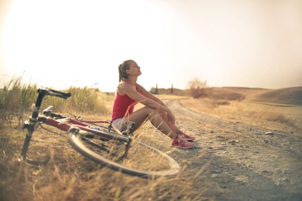 woman outside next to bike