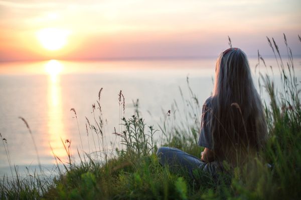woman meditating outside