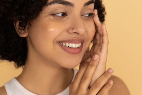 woman holding face with nice skin